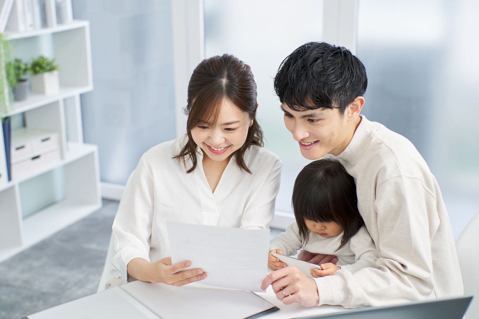 Asian family considering purchasing insurance